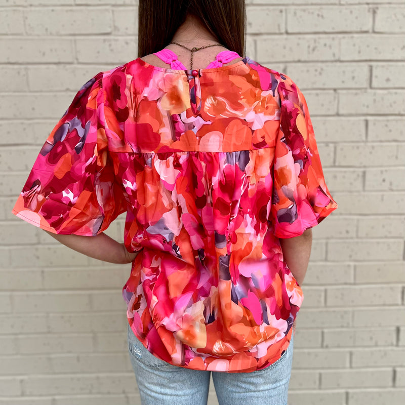 The Garden Rich Blouse will quickly become your go-to top for effortless style. Featuring a classic red floral print, plus wide sleeves for a relaxed look, you'll look effortlessly chic. Made of breathable fabric, it's both comfortable and stylish.  100% Polyester