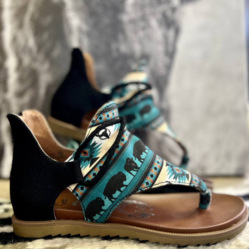 These Sandals are perfect for any occasion. The turquoise, black, and Khaki colors of these sandals makes these shoes a statement. Complete with a buffalo roam scene all through out. They are so lightweight and have a very comfy sole. True to size.    