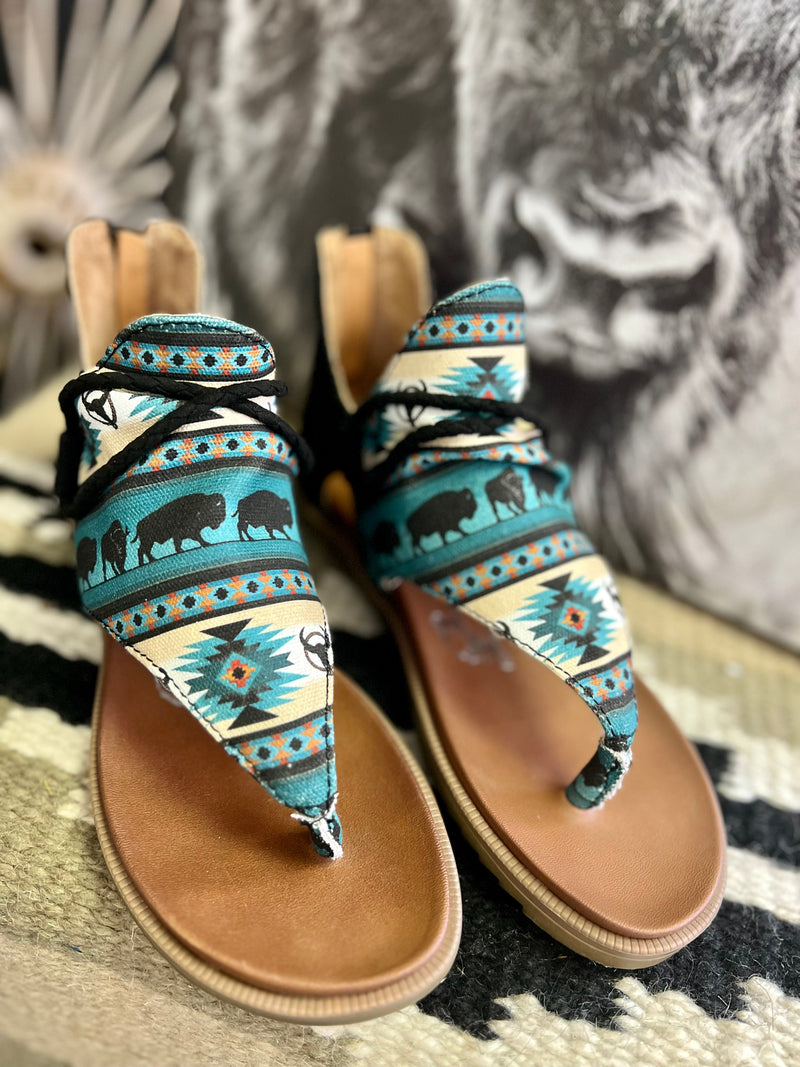 These Sandals are perfect for any occasion. The turquoise, black, and Khaki colors of these sandals makes these shoes a statement. Complete with a buffalo roam scene all through out. They are so lightweight and have a very comfy sole. True to size.    