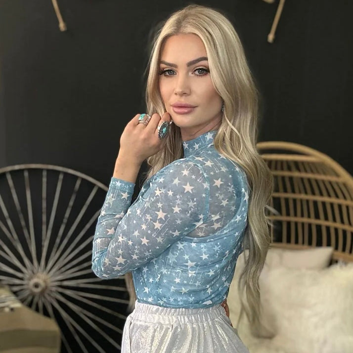 Explore the night sky while wearing the Keeper Of The Stars Top! This beautiful blue mesh long sleeve top is covered in white stars, making it perfect for star-gazers, late-night walkers, and fashion-forward dreamers. Step out of this world in style!  96% POLYESTER 4% SPANDEX