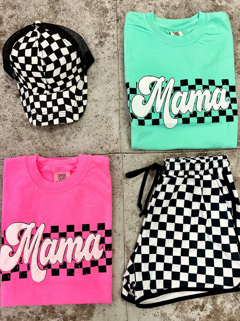 Puff letter tees. Mama tees. Graphic tee. Trending graphic tees for moms. Mother's day gift. Mom shirts. Race flag design. Black checkered. Mama shirts. Mama graphic tees. Short sleeve t-shirt. Crew neck t-shirt. Casual mom outfit. Casual tee. Trending outfits. Pink graphic tee. Mint graphic tee. Boutique. Small biz.