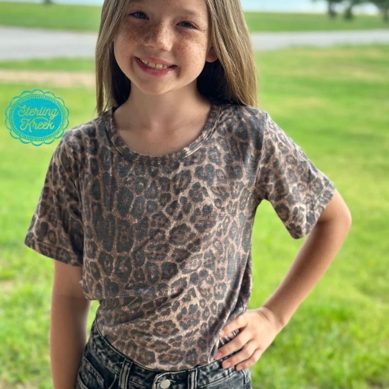 Let your kids express their wild side with this Sweet Caroline Top Kids Faded Cheetah Tee! Featuring a fun and wild cheetah-inspired pattern, this top will have them roaring with delight. Perfect for everyday wear - you'll be the coolest cat on the block. Purr-fection!