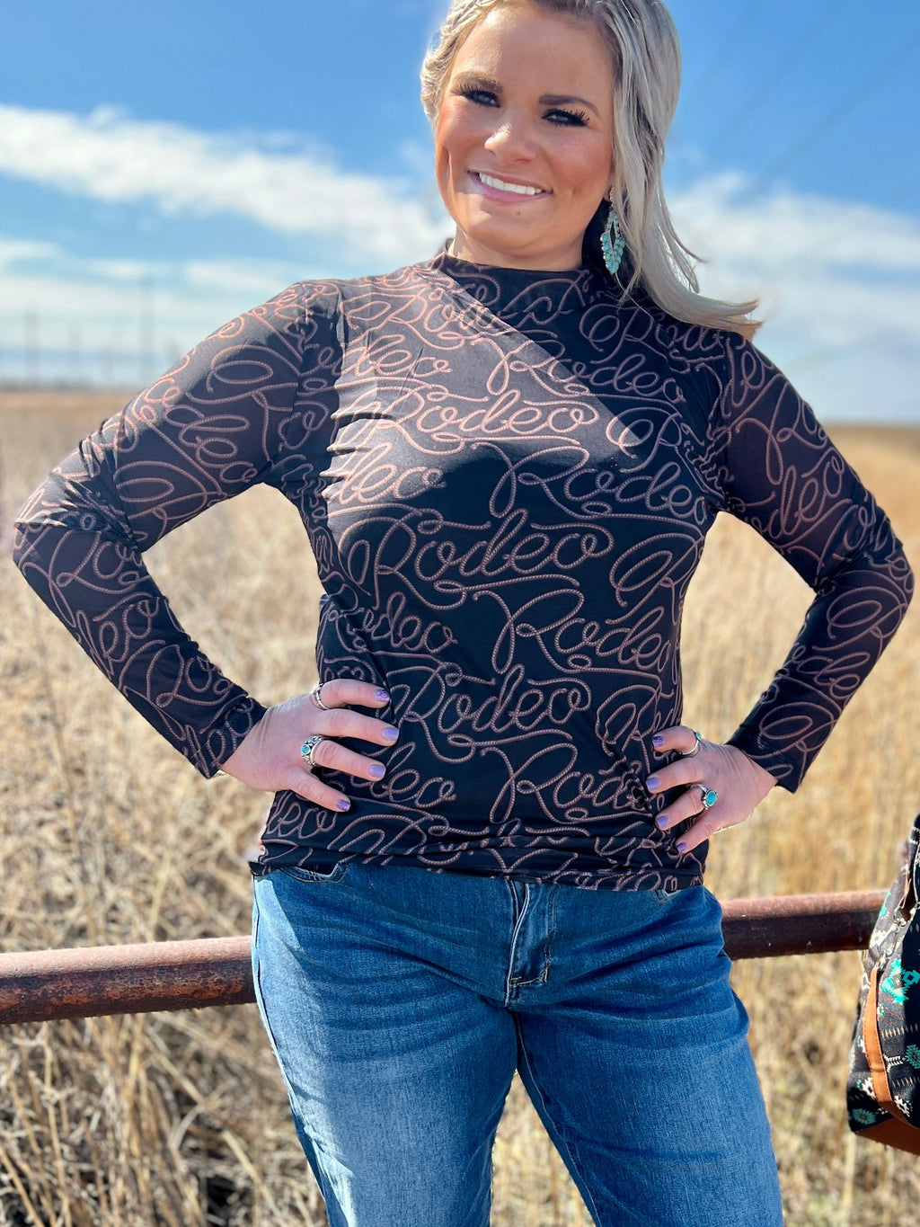 Sterling Kreek Rodeo Queen Top. Western style sheer top. Western style mesh top. Rodeo top. Rodeo mesh top. Rodeo sheer top. Women's sheer tops. Layering tops. Western fashion. Fashion Trends 2024. Black mesh top. Black sheer top. Western outfit. Rodeo outfit. Western boutique. Small business. Woman Owned.