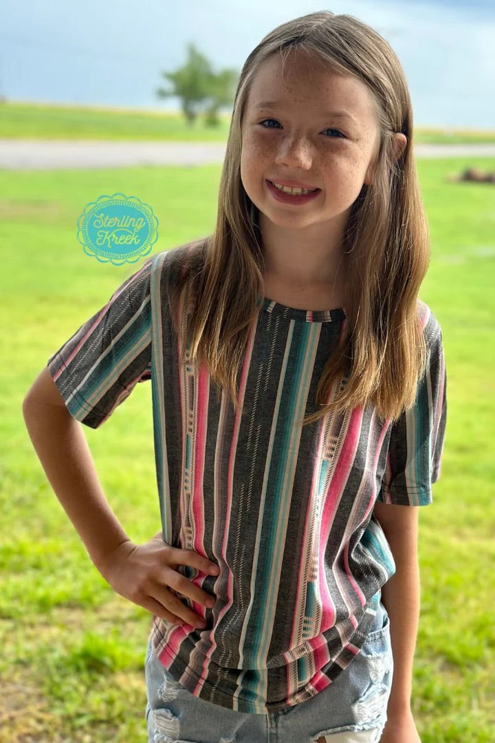 Show your love for Serape City with the Kids' Serape City Heart Top. Featuring a faded and colorful serape pattern, this tee guarantees to bring a little extra shine to their sunny days! Perfect for a kid who loves to stand out in style. ;)  26% Cotton, 69% Polyester, 5% Spandex