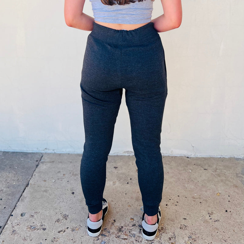 Level up your lounging game with our L&B Joggers! As soft as a cloud, these must-have joggers come with drawstring waistband, handy pockets, and available in three colors: black, charcoal, and turquoise. Perfect for a night in, working out, and everyday casual wear!  60% Cotton  40% Polyester 
