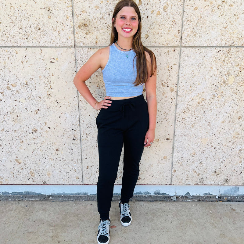 Level up your lounging game with our L&B Joggers! As soft as a cloud, these must-have joggers come with drawstring waistband, handy pockets, and available in three colors: black, charcoal, and turquoise. Perfect for a night in, working out, and everyday casual wear!  60% Cotton  40% Polyester 