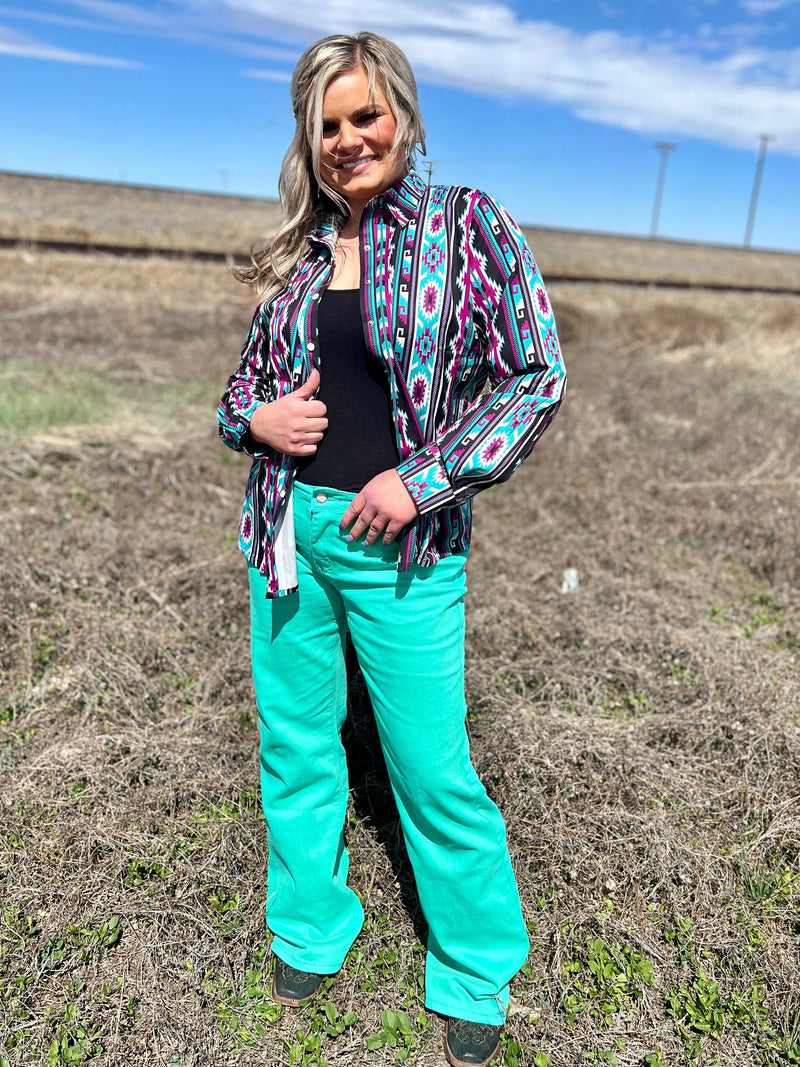 Sterling Kreek Denim. Turquoise denim bootcut jeans. Western style jeans. Western style. Colored denim jeans. Vintage inspired western denim. regular inseam turquoise denim jeans. Women's western boutique. Women's western wear. Small business. Woman owned. Online boutique. Fast shipping from Texas.
