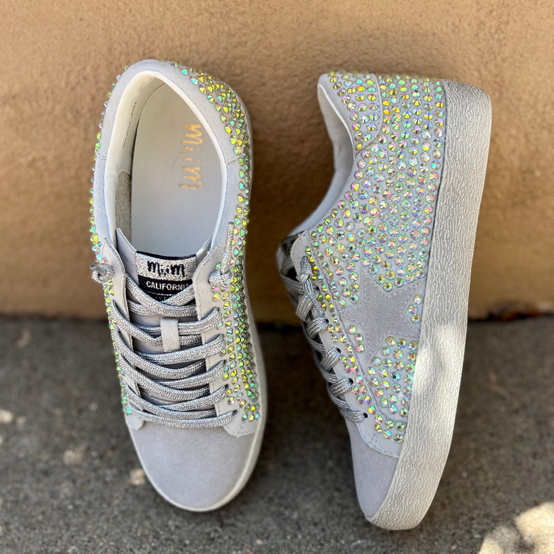 Our Grey Haze sneakers take casual to the next level with a grey star on a silver lace up and a multi-color rhinestone detail. The combination of these features ensures an eye-catching look, while the soft grey suede provides all day comfort.