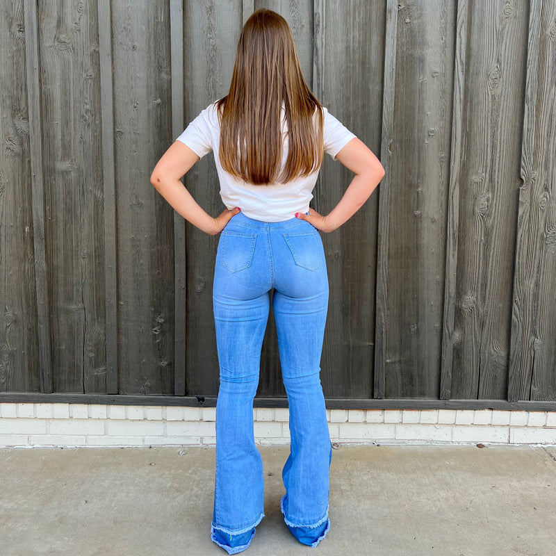 Experience denim revival in Retro Girl Light Wash Flares. Crafted with high-waisted stretch denim, these distressed flares provide a formed fit while being flattering to the figure. With a thick hem and a 70s-inspired style, these trousers offer classic charm with a modern edge.