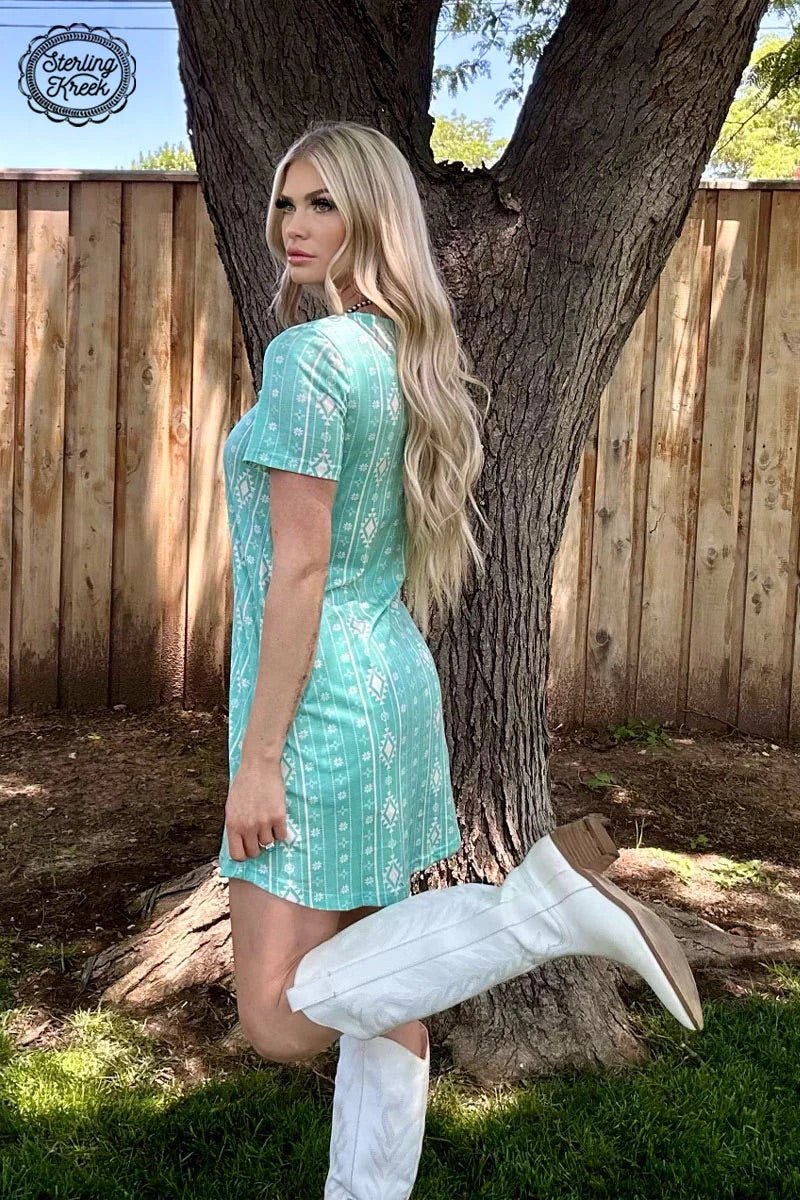Make a statement with this unique Walking In Turquoise Dress! Show off your trend-setting style with its vibrant turquoise hue and eye-catching white aztec print. Turn heads wherever you go - you'll be the life of the party!  94% polyester 6% spandex 