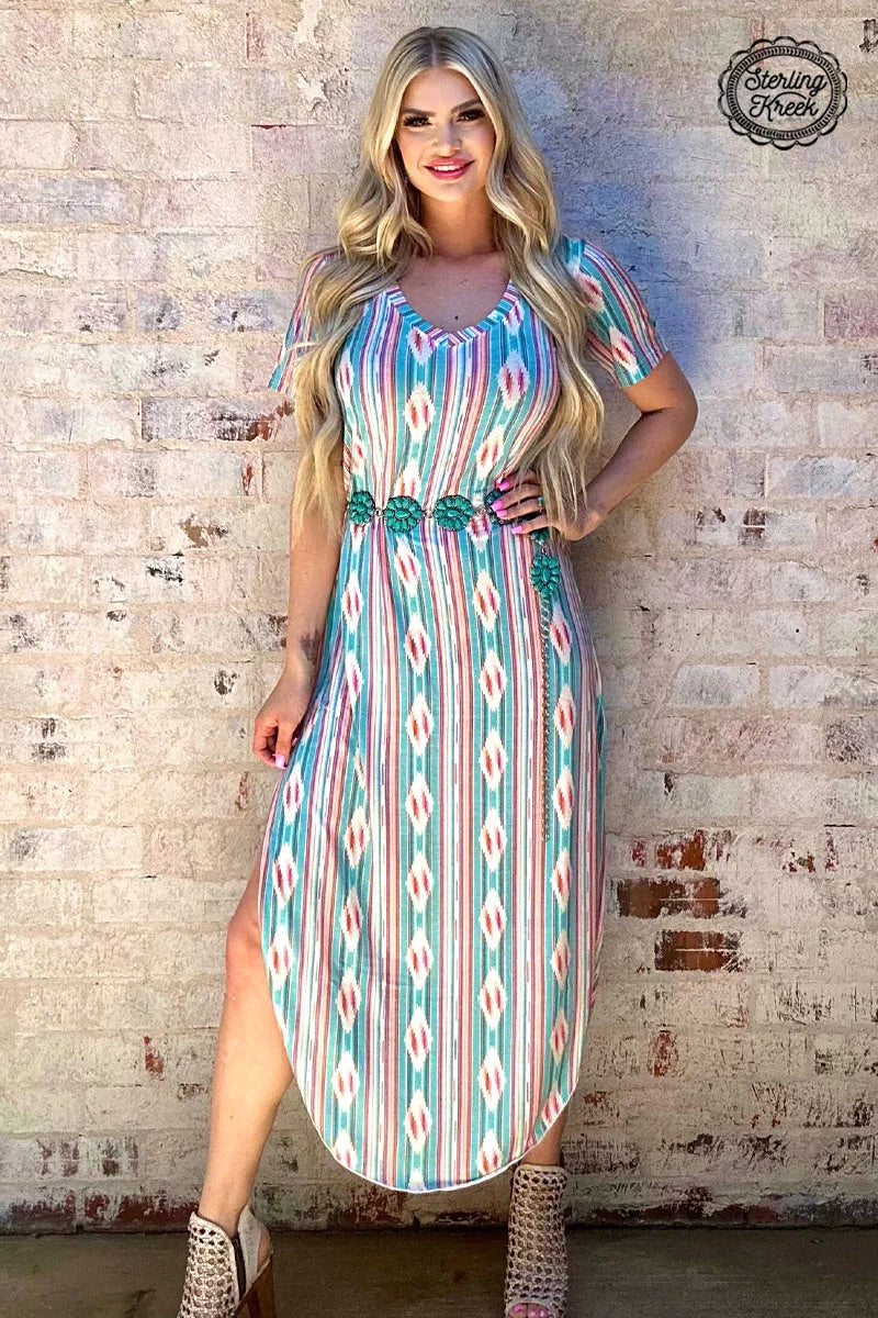 Feel like "Mamma Mia!" in this v-neck maxi dress! This faded beauty features a stylish serape/aztec print that'll have you singing "Dancing Queen" all night long. Get ready to turn heads with this showstopper!