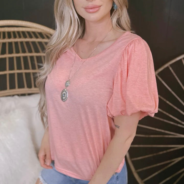 Show off your laid back style with this super soft "San Antonio Stroll" top! Its lightweight heather fabric and peach shade give it a dreamy, beachy vibe - perfect for a summer day stroll. Get ready to look stylish and stay comfy all season long!