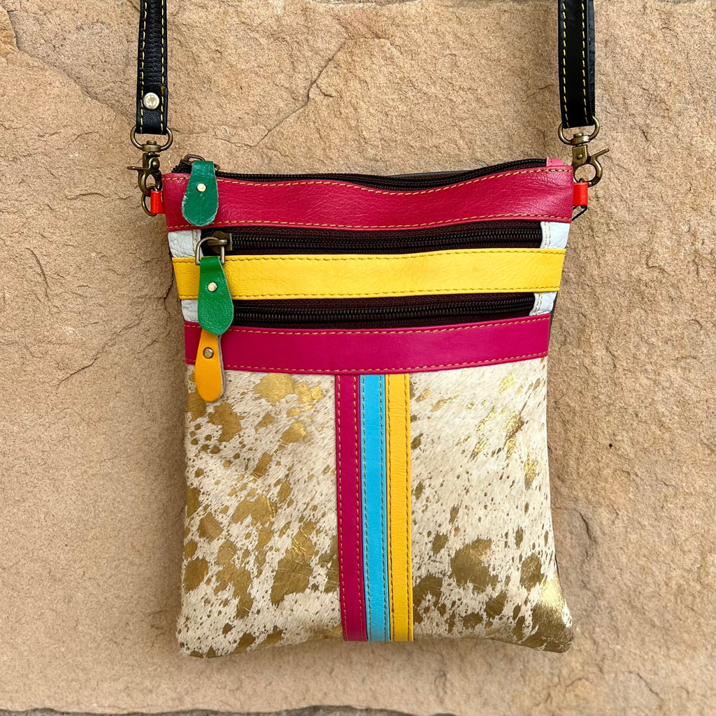 Make a statement with the Kaizer Crossbody. Available in two unique color options, this stylish and sophisticated bag is crafted with multi-colored leather detail and an adjustable, removable strap for convenience. Its distinctive pattern and modern design makes it perfect for bringing luxury to any look.