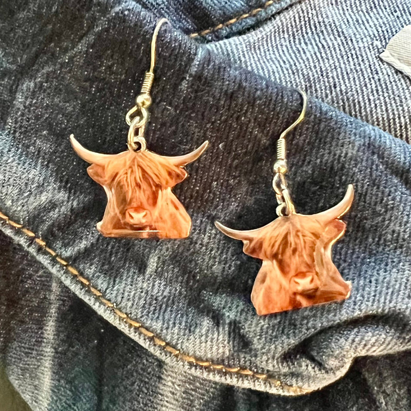 Exquisitely crafted from premium materials, these Highland Cow Earrings add a luxurious, elegant touch to any outfit. Featuring a delicate fish hook and 1.5" dangle, this beautiful homage to nature will complete your fashionable ensemble with a timeless touch.