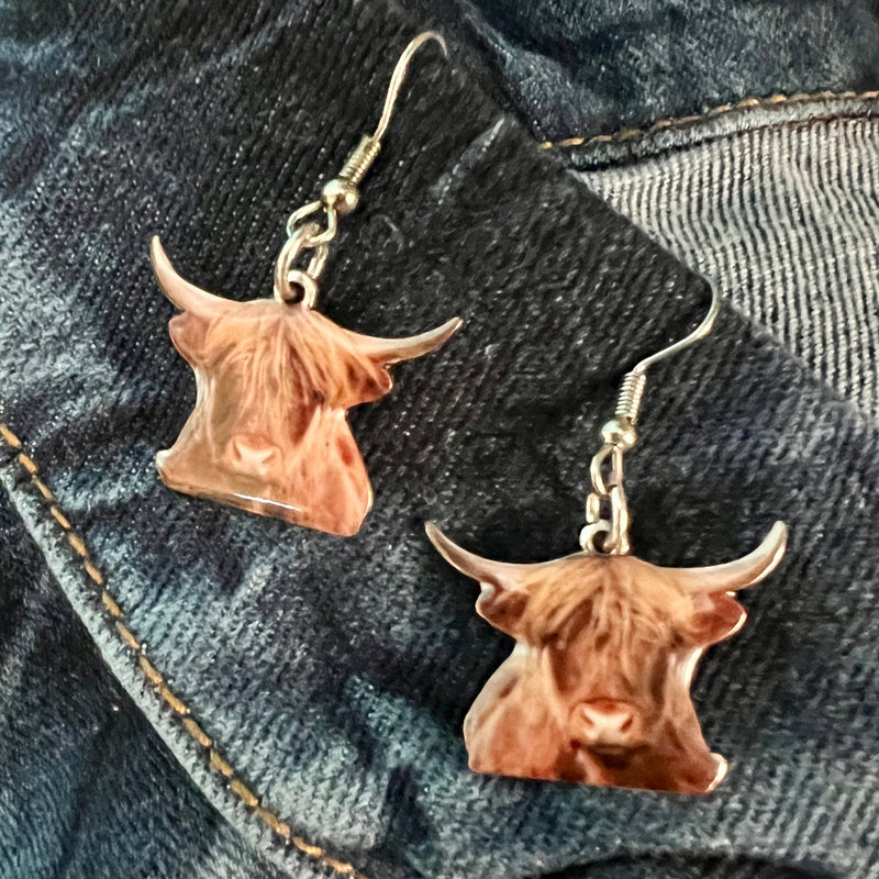 Exquisitely crafted from premium materials, these Highland Cow Earrings add a luxurious, elegant touch to any outfit. Featuring a delicate fish hook and 1.5" dangle, this beautiful homage to nature will complete your fashionable ensemble with a timeless touch.