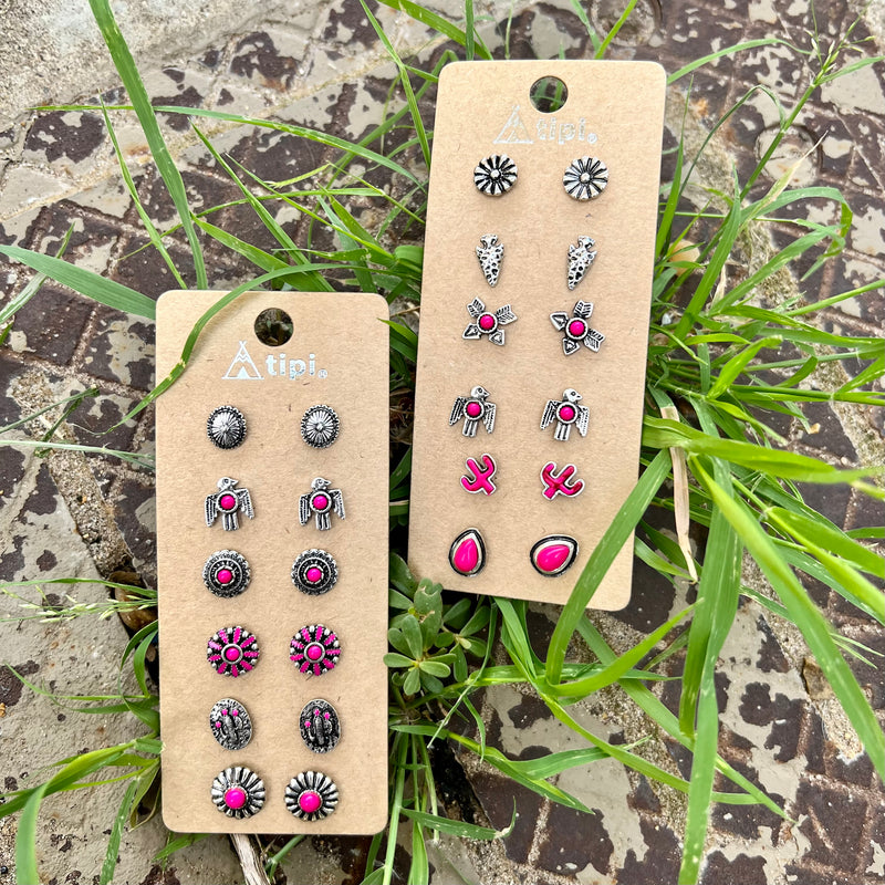 Indulge in effortless elegance with this set of 6 pink earrings, offering two beautiful options. Crafted from silver and adorned with pink stones, choose from round pink studs with thunderbird details or Indian arrowhead shapes with pink cactus and thunderbird details. Imbuing a sophisticated western charm, each piece is thoughtfully stamped with heirloom-quality details.