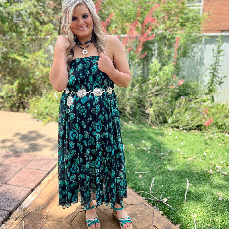 Dive into the Wild West with this Concho Kreek Maxi Skirt! Featuring vibrant turquoise squash blossoms and a black slip underneath, you can be sure to make a statement of style. Ready for a wild and adventurous day? Saddle up and get ready to ride!