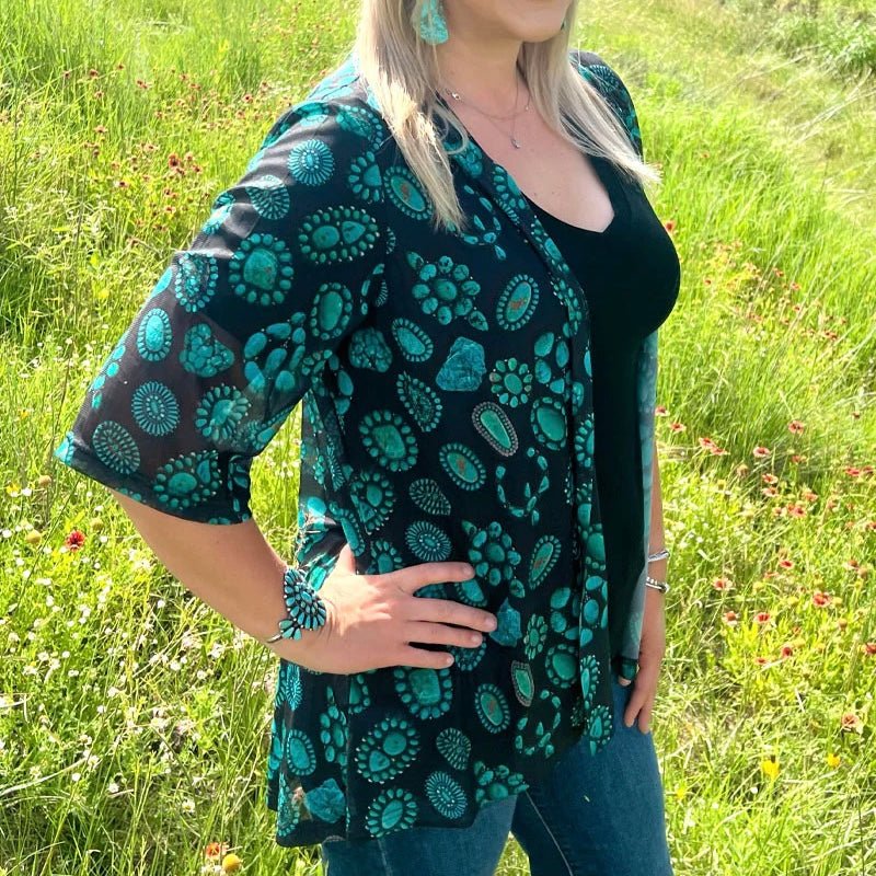 For something a bit more stylish than a plain black cardigan, add a "Touch of Turquoise"! Perfectly detailed with an eye-catching squash design, this cardigan will give any outfit a unique and playful flair!  96% Polyester, 4% spandex