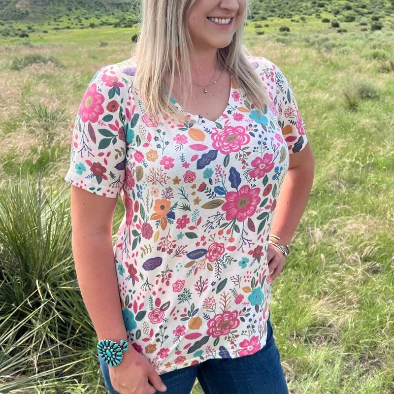 Say goodbye to your average white tees - the PLUS Mayflower Top is here to transform your look with its stylish white v-neck and cheery floral pattern! Unfurl your fashion sense in this carefree top and be as fresh as a daisy!  55% cotton 40% polyester 5% spandex 