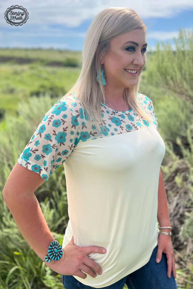 Stay fresh in this Summer In The City Top! This stylish look features a delicate floral mesh top combined with a classic cream tee bottom. Perfect for those warm summer days, you'll be looking great while staying cool!  94% modal, 6% spandex