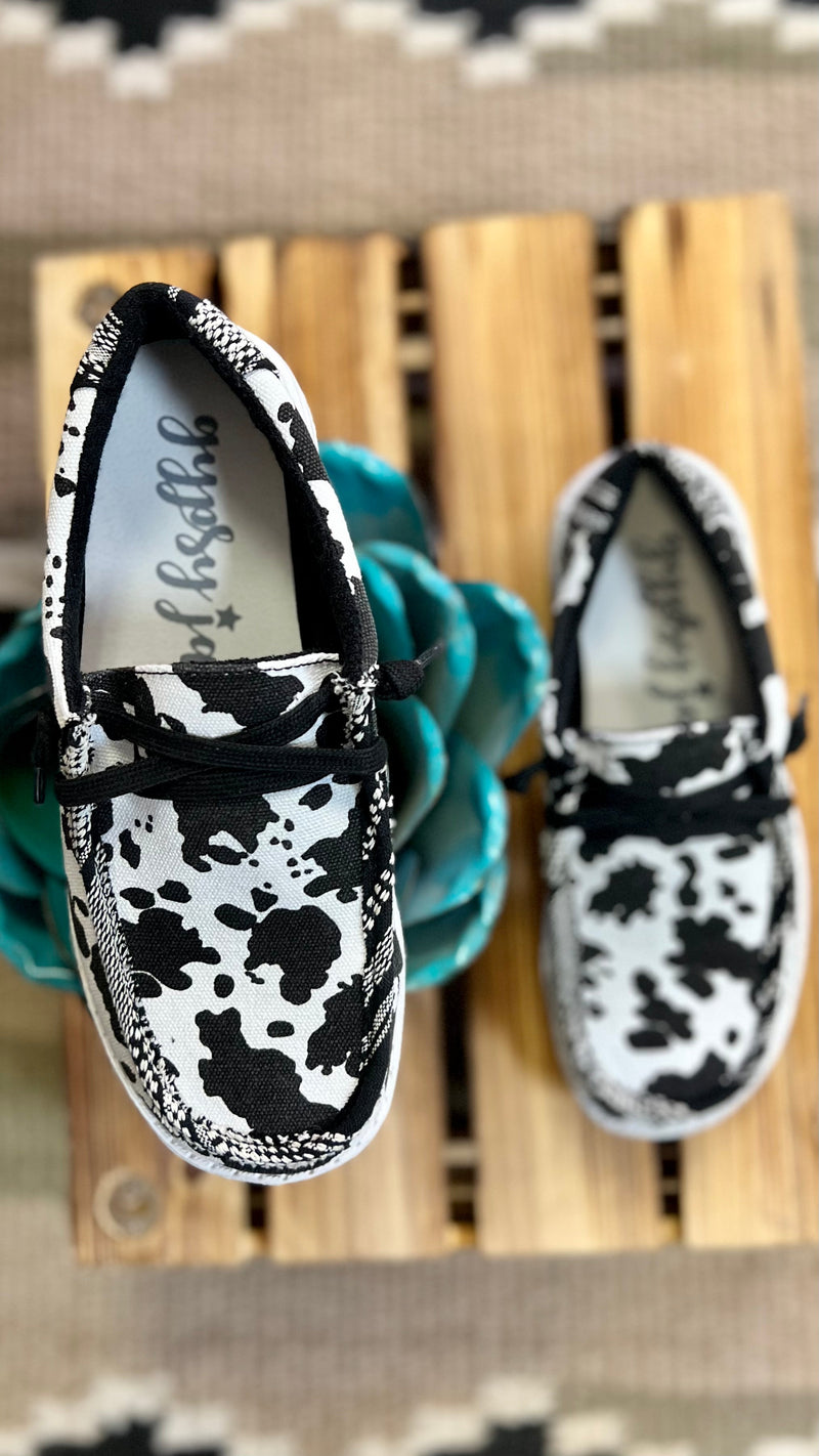 Introducing the Cow in a Meadow Loafers. Gracefully crafted with a black and white cow print for a timeless look, and a black and white aztec print to add a splash of character. Slip on with ease and a comfort sole for a luxurious, relaxing fit. All together, these shoes offer a beautiful and comfortable look for any occasion.