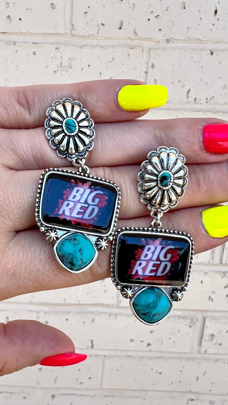 Strut your stuff with these playful Big Red Earrings! Their western gemstone and concho flower give 'em a sassy style, while the big red drink logo and post back keep 'em sparklin' from day to night. Perfect for any special occasion, you'll love danglin' these ear-resistible beauties!