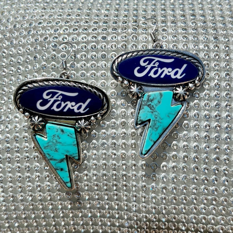 Express your love of classic American brands with these Ford Earrings! Featuring a western-style concho in a high-polish silver finish, plus a thunderbolt and Ford logo for the perfect combination of style and spirit. Hang 'em up with the cable-textured fish hook and show off that unmistakable dangle!