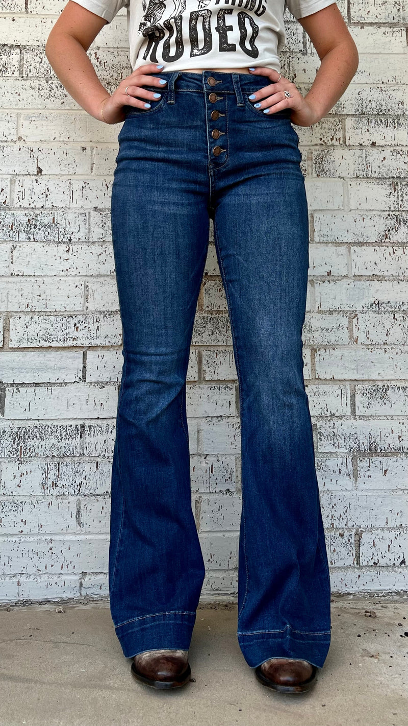 The Judy Booty Trouser Jeans will give you the stylish boost you need, no booty call required! This high-waisted, button-fly denim is a classic trouser flare that'll make your legs look miles long - a total bombshell look! The dark denim goes with pretty much anything, and with a 32" inseam, you can feel confident and look fabulous!