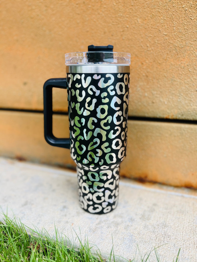 Catch everyone's eye on your next summer adventure with this trendy 40 oz. tumbler! The insulated cup keeps your favorite drinks cold and comes complete with a wild iridescent leopard pattern - perfect for showing off your wild side. Plus, it comes with a lid and straw, so you can sip in style wherever you go. We call it Big Like Texas; you'll call it your summer must have!