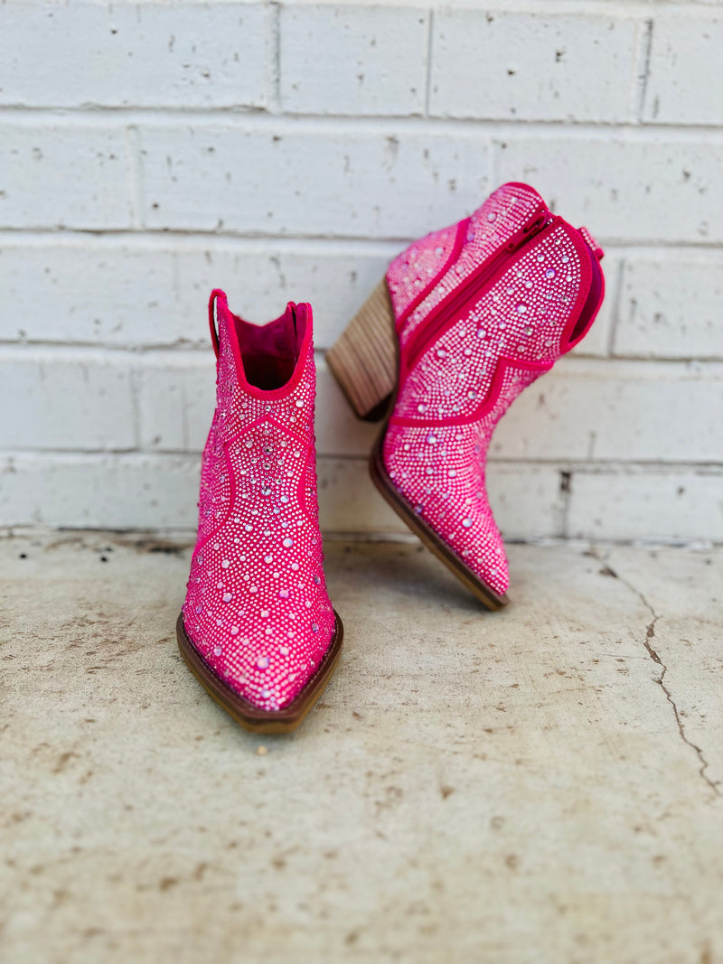 The Leg Up Pink Booties are your shortcut to style! With a 3" heel, pointed toe and pink rhinestone details, you'll strut in confidence and find your way through life with ease. Plus, the inside zipper means you won't find yourself endlessly searching for a way out. Look great, feel great! 8" in total height