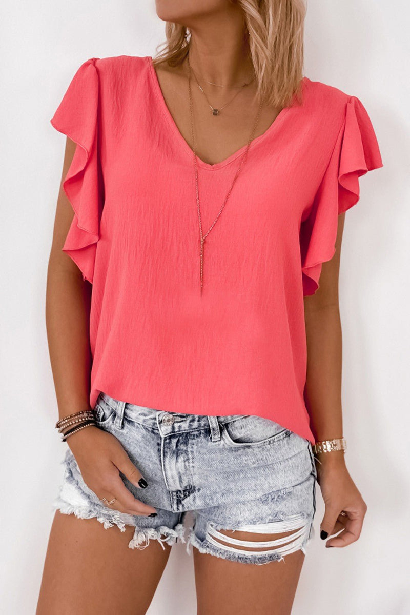 This top is a fashion classic – coral in color, stay loose and comfortable in a V-neck, ruffle sleeve, shift fit with a chic back tie design, all made from a comfy soft fabric. Look good, feel good, party on!