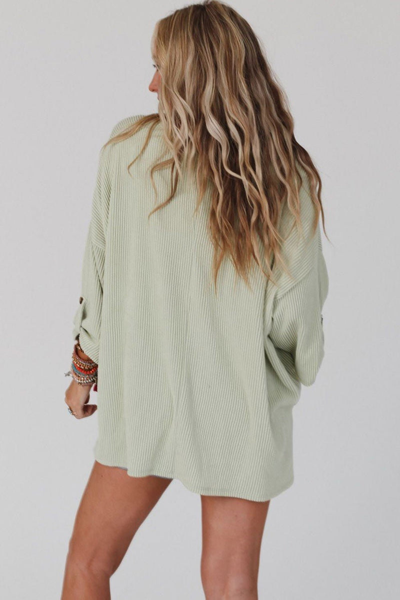 Stay cool and comfy in this stylish yet cozy "It's Her Oversized Top"! Crafted with ribbed material and a chest pocket, this oversize green top will have you feeling like a million bucks. The roll tab sleeves add a fun twist, ensuring you stand out from the crowd!