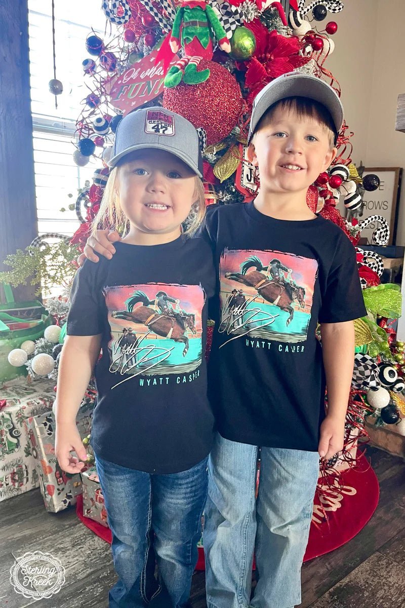 Say yee-haw in style with this black tee featuring bronc rider Wyatt Casper. Its classic, western inspired look is bound to make any kid feel like the luckiest cowboy/cowgirl in town!
