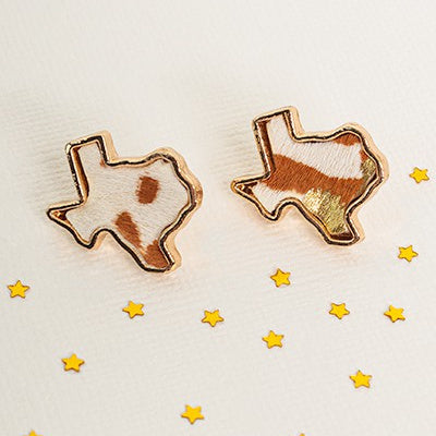 These Little Texas Earrings are perfect for adding an elegant, yet wild, flair to any look. The dainty, animal-print hair-on-hide post-back studs are available in four colors — brown and white, leopard print, leopard print and gold splatter, and black and white with gold splatter — and measure .75" in length. These stylish earrings will evoke a sense of sophistication and daring that can complete any ensemble.