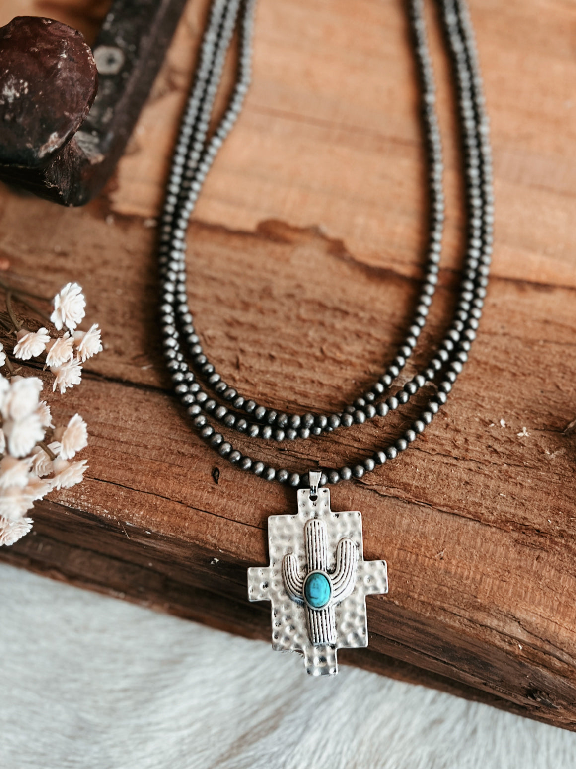 Multi-Strand Navajo Pearl Strand Necklace With A Cactus Pendant