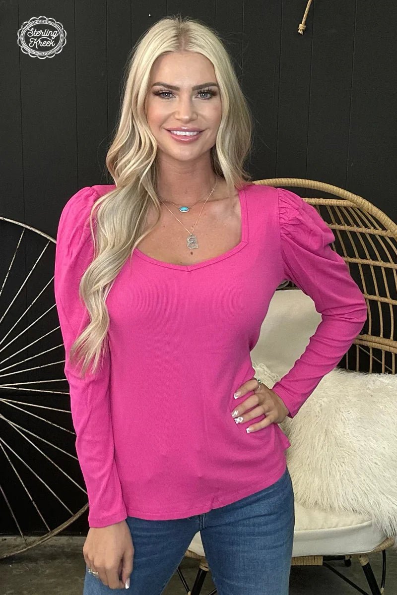 Introducing the Something Classy Pink Top! This stylish very flattering top is perfect for a night out with the girls - featuring a long sleeve ribbed fabric and trendy bubble sleeves, you'll look as chic as can be without breaking the bank. Look majestic-est and wave goodbye to boring fashion! Upgrade your wardrobe with this vibrant hot pink ribbed top with stylish bubble sleeves! It's sure to add a classy touch to any outfit and leave you feeling fierce! #BarbieVibes