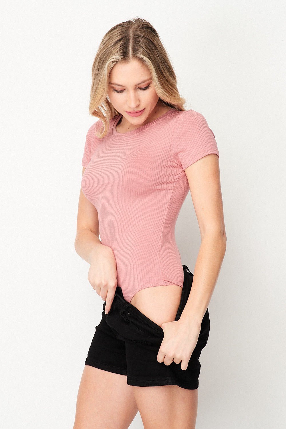 Look cool and feel comfy with this Solid Rib Knit Short Sleeve Bodysuit! It’s made of ribbed knit fabric, with a flattering round neckline and awesome short sleeves – you’ll be ready to rock’n’roll with your fave pair of jeans and sneakers, in no time! So, don’t hesitate, grab it now to be the comfiest and chicest one in sight.   93%Rayon 7%Spandex