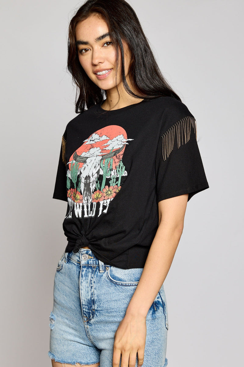 Looking for something to show off your wild side? Look no further! This Wild Life Crop Top is sure to turn heads with its crew neck and beaded fringe embellishment on the shoulders. Plus, its desert scene graphic gives off those totally chill, boho vibes. Time to get wild!