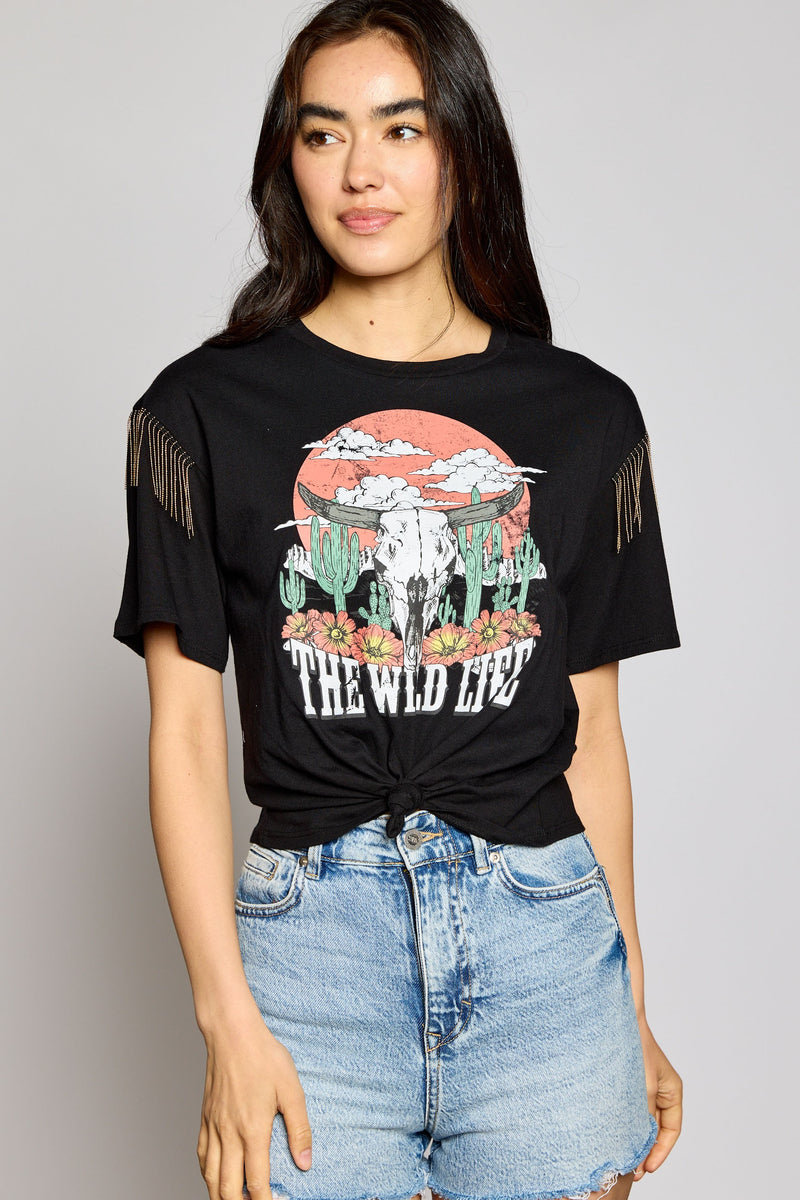 Looking for something to show off your wild side? Look no further! This Wild Life Crop Top is sure to turn heads with its crew neck and beaded fringe embellishment on the shoulders. Plus, its desert scene graphic gives off those totally chill, boho vibes. Time to get wild!