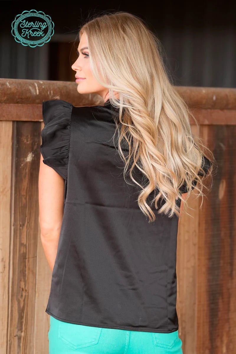black. short sleeve. high neck. ruffles. polyester. flirty and chic. Small business. woman owned business. get gussied up. western boutique. womens western boutique.