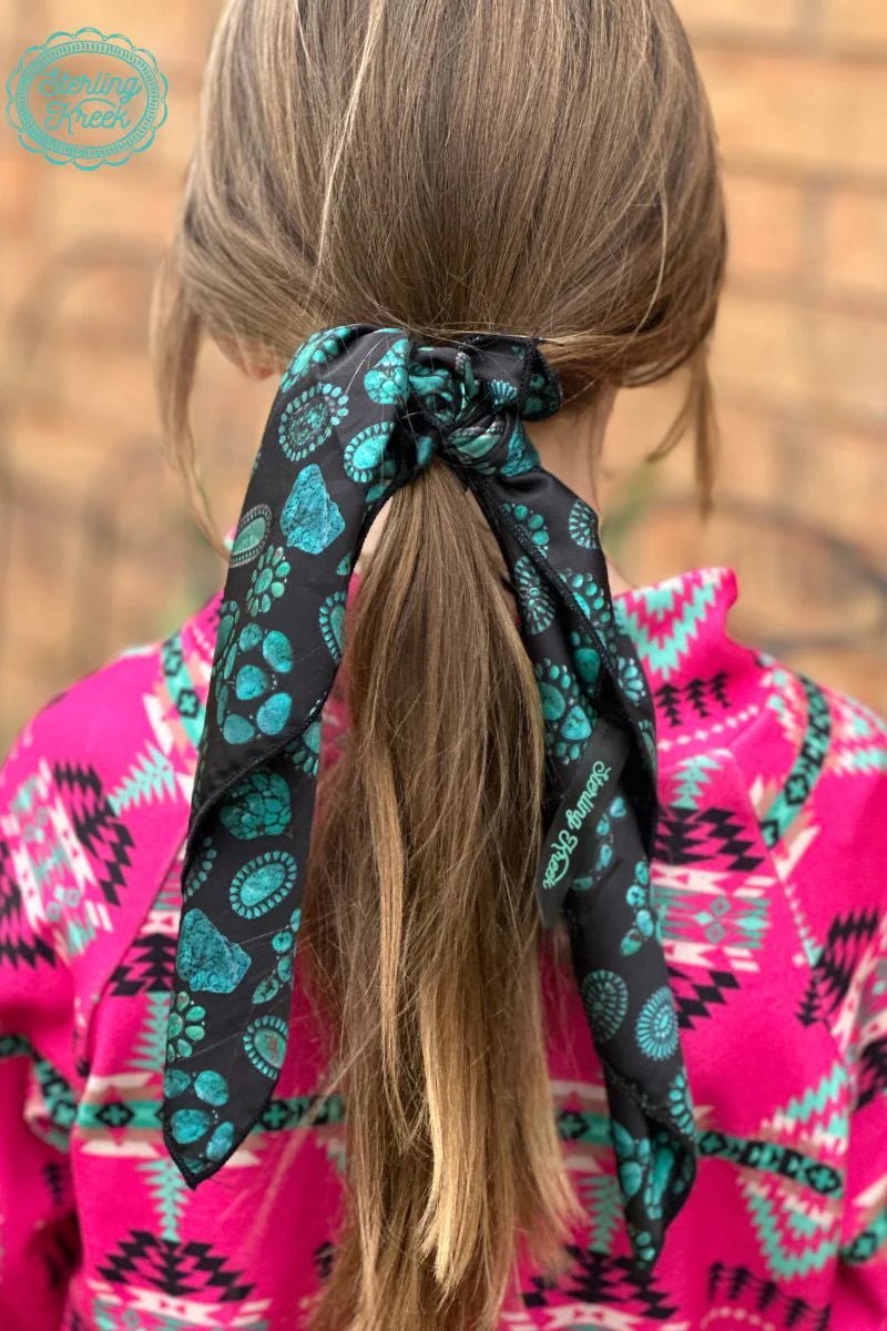 Add a little flair with this mini concho kreek wildrag, perfect for adding a touch of fun to any outfit. With a black wildrag base and conchos for an added dimension, you'll be oozing unique style in no time. Such a small piece, such a BIG statement!  19" X 19"