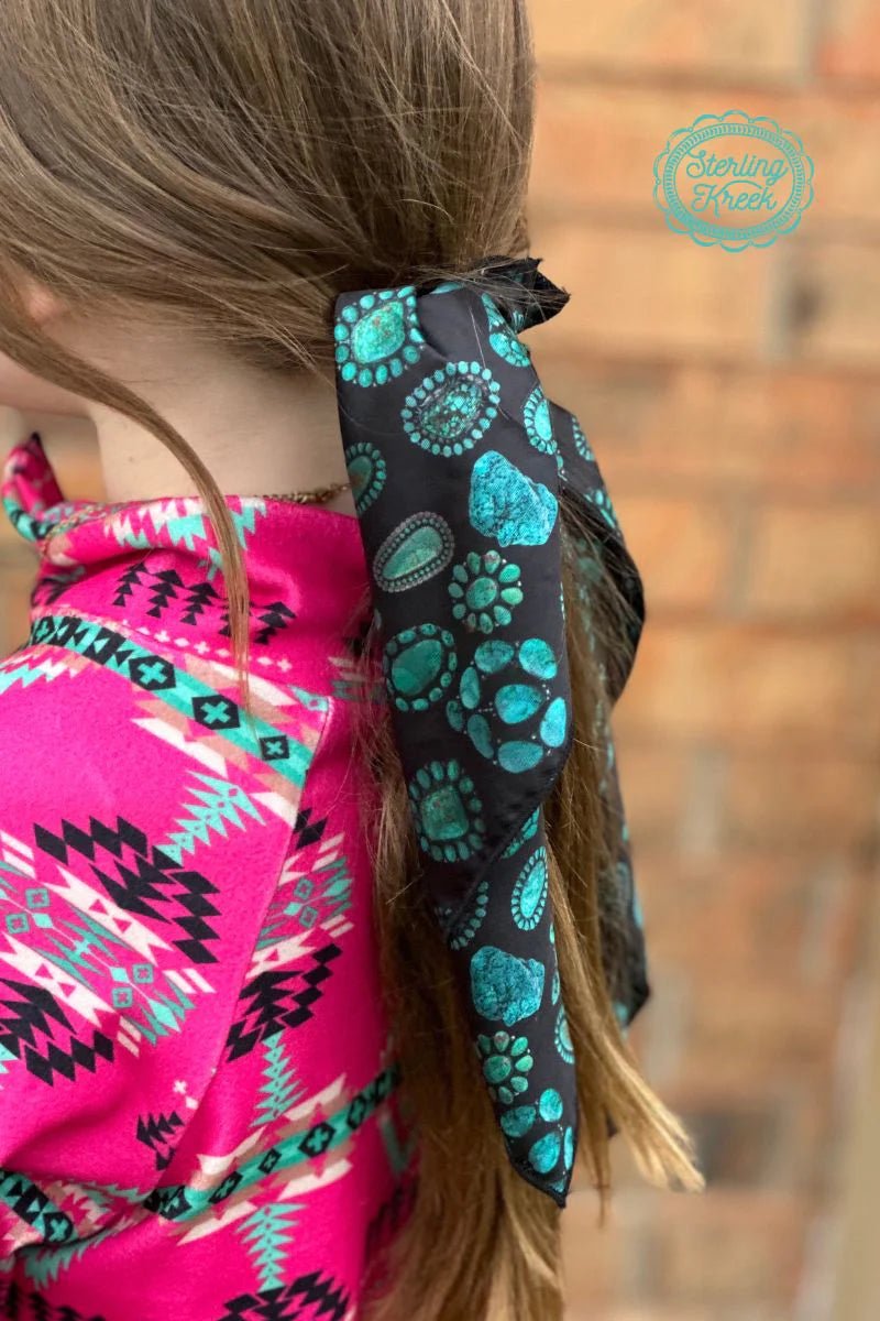 Add a little flair with this mini concho kreek wildrag, perfect for adding a touch of fun to any outfit. With a black wildrag base and conchos for an added dimension, you'll be oozing unique style in no time. Such a small piece, such a BIG statement!  19" X 19"