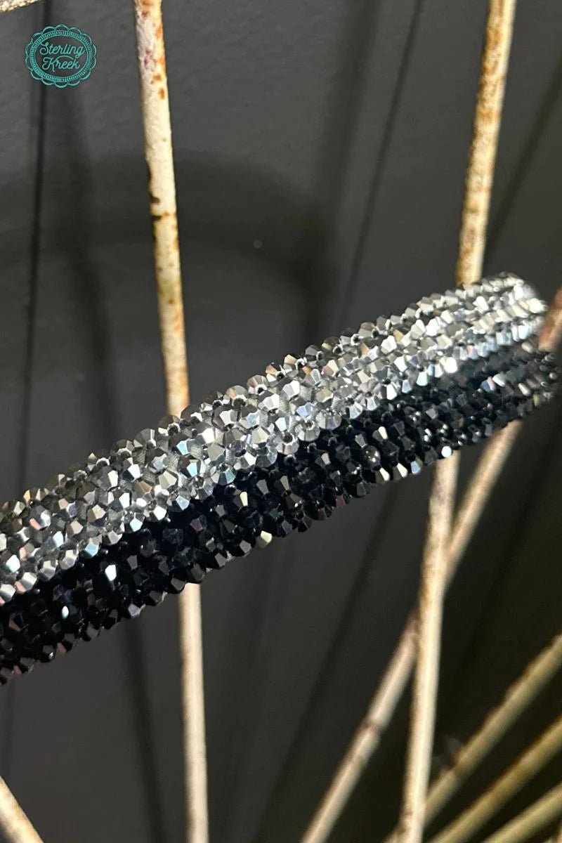 Show off your sparkle with our Rhinestone Headbands. Whether you're looking for a pop of silver or a cool black, we've got you covered! Don't be shy—these headbands will help you shine bright like a diamond!