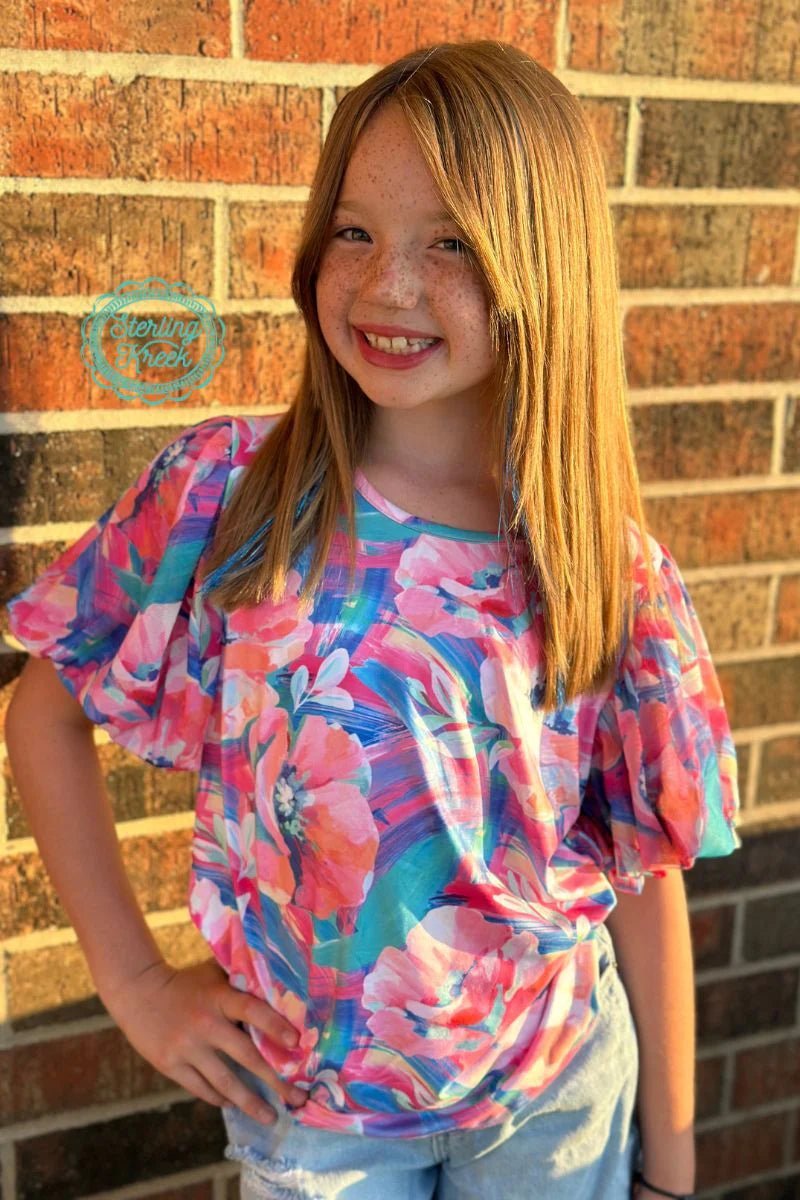 Introducing the Mini Bloomin' Boss Top - put a little flower power in your wardrobe! This top features a dreamy floral print plus bubble mesh sleeves for a bit of added flair. So unleash your inner flower child and add a unique touch to your style!  94% POLYESTER 6% SPANDEX