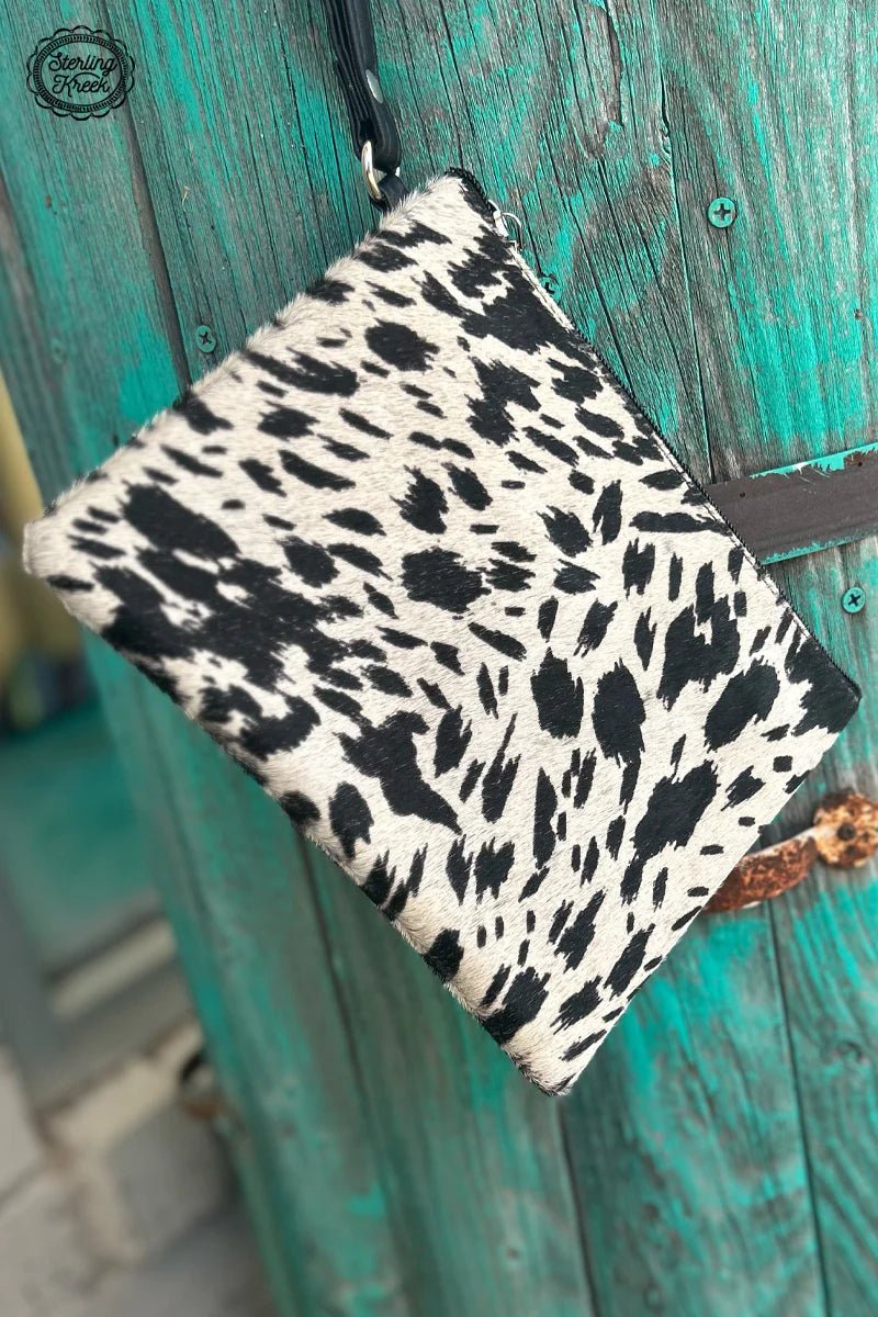 Introducing The Clarabelle Bag! An incredibly chic bag made from white and black cowhide. It's perfect for any trendsetter looking to show off their sassy side. Plus, with its eye-catching black and white aesthetic, this bag is sure to turn heads and make you stand out from the crowd!    8"X6.5"  strap 8"
