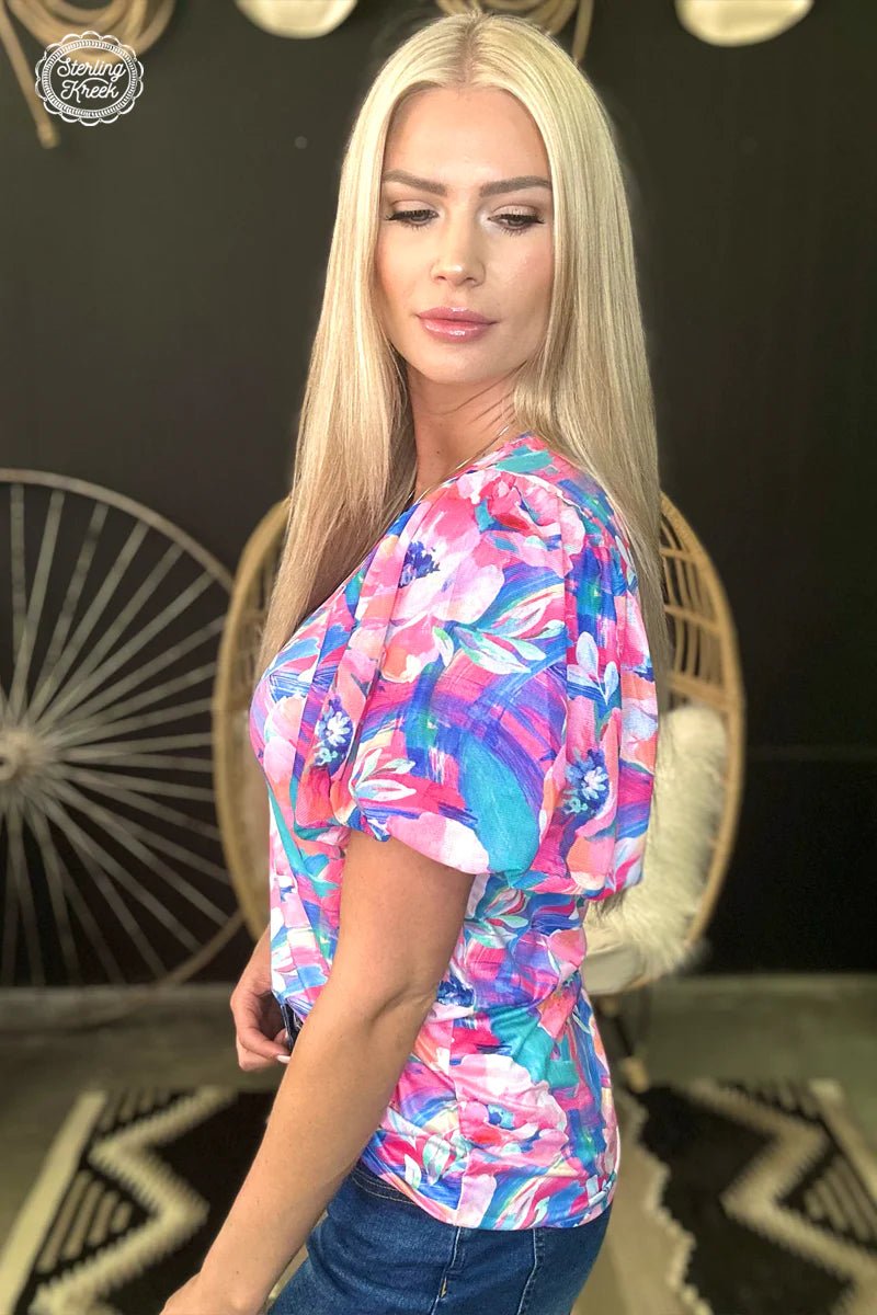 Look blooming beautiful in the Bloomin' Boss Top! Featuring a floral print and mesh bubble sleeves, this unique top is sure to have heads turning your way. Show off your bright style with this flirty and fun look!  50% POLYESTER 45% COTTON 5% SPANDEX