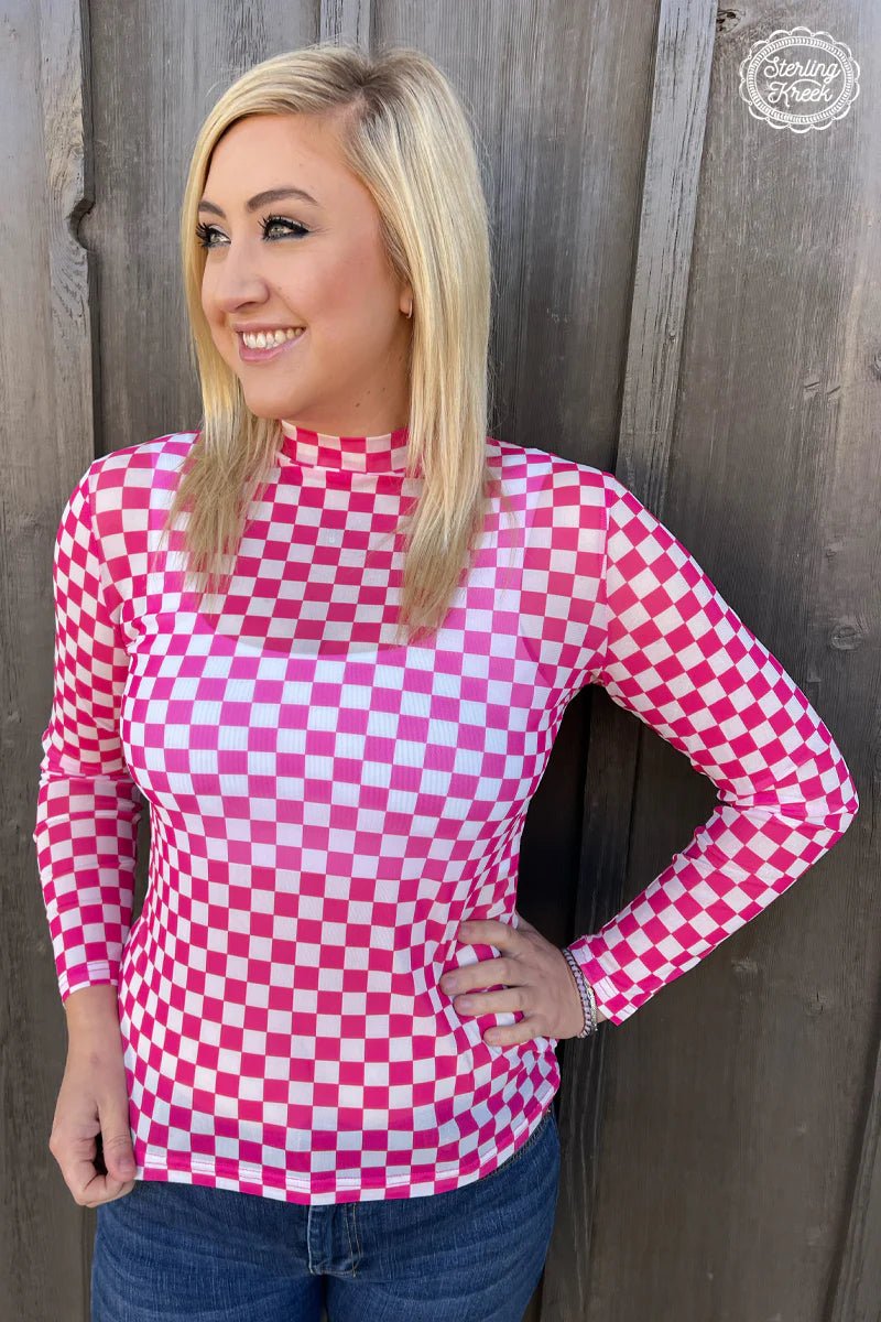 Be the picture of confidence and ready to take on any challenge in our Refuse to Lose Top. Take center stage in this white and pink checkered mesh top – you'll show 'em who's boss! Keep it cute and cozy while making a statement – your wardrobe just won the championship!  96% POLYESTER 4% SPANDEX