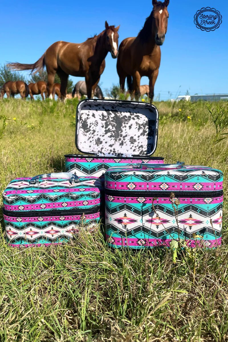 Set of 3 NESTING boxes.   Our cow-ztec Beauty Boxes are sure to get you moo-ving! With three sizes to choose from and featuring a bright and bovine-ful cow print on the inside and a pink and turquoise aztec pattern on the outside, these boxes make for a trend-setting beauty storage solution that makes a moo-d statement.  Small : L 7.25" X W 4" X H 4"  Medium : L 8.25" X W 5" X H 5"  Large : L 9.25" X W 6" X H 6.75"