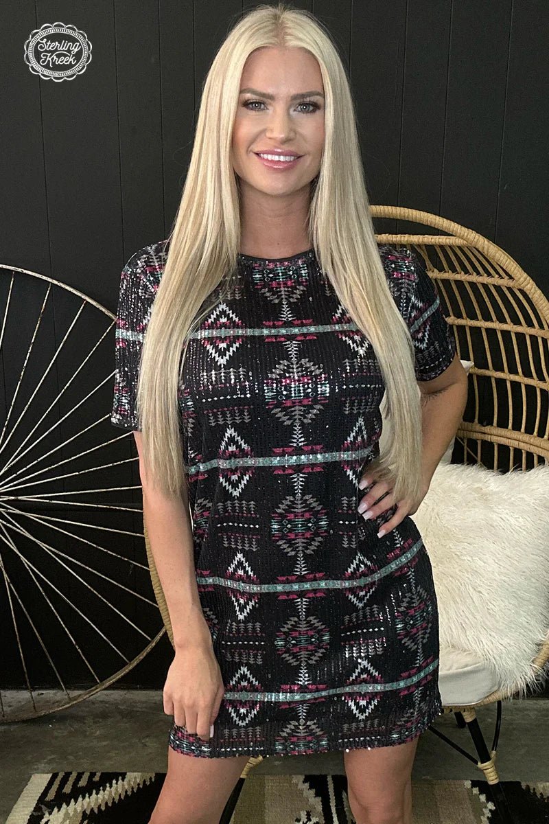 Turn heads and make a statement in the Remember Me dress! This beautiful black sequin ensemble is a dramatic mix of style and fun - the perfect match for a night out. With the unique aztec designs, you'll be sure to remember this dress for years to come.