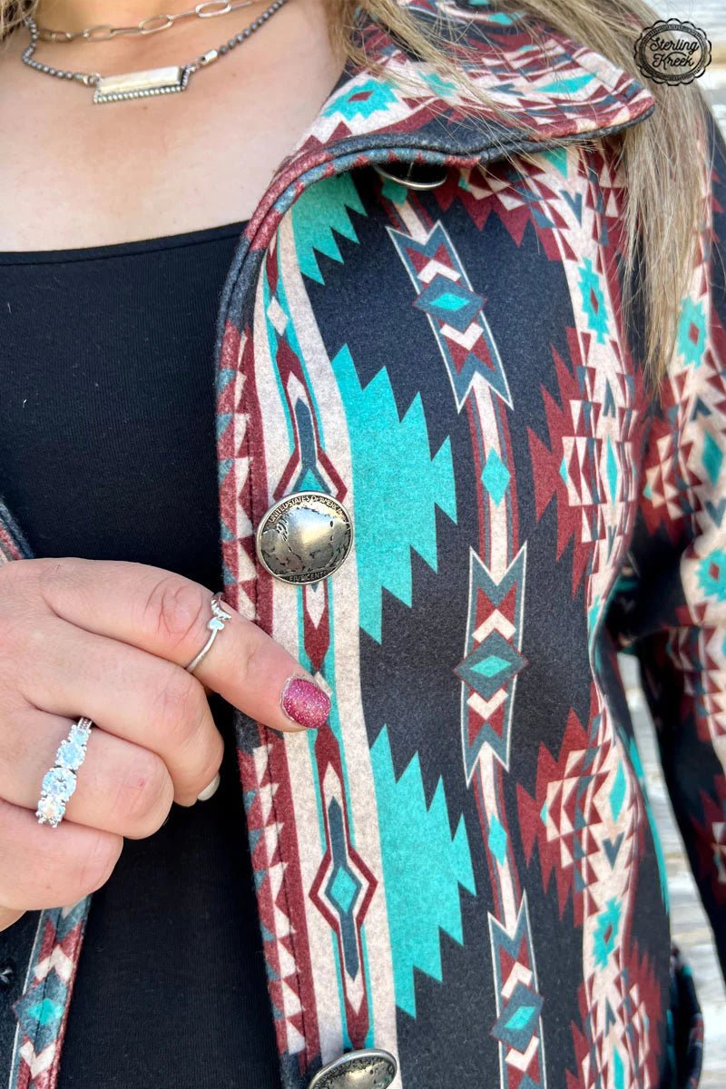 Ready to take your style up a notch? Look no further than the Durango Kreek Jacket! This eye-catching Aztec-patterned jacket features vibrant turquoise, marron, and cream colors and is finished with authentic Buffalo-nickel buttons. Put some spice in your wardrobe!  93% POLYESTER 7% SPANDEX